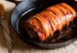 Wie man im Ofen gebackenes Schweinefleisch mit Speck kocht Saftiges Schweinefleisch mit Speck, im Ofen gegart: ein einfaches Rezept